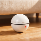 FELVO Orbit, Automatic Laser Ball Toy styled in a warm modern interior